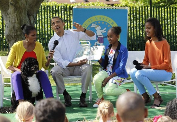 U.S. President Obama reads "Where the Wild Things Are" alongside first family during White House Easter Egg Roll in Washington