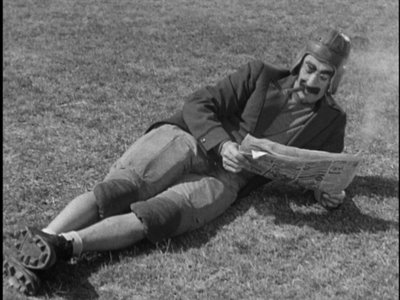 groucho reading newspaper