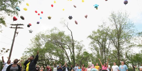 People gather to remember Michelle Knight and release balloons in her honor in a field on Scranton Ave. at Mentor St. on Thurs, May 8, 2013. (Thomas Ondrey/The Plain Dealer)