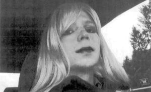 This undated photo provided by the U.S. Army shows Pfc. Bradley Manning posing in a wig and lipstick.