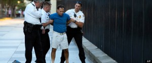A man is taken into custody by uniformed Secret Service Police on Pennsylvania Avenue outside the White House on Monday, 