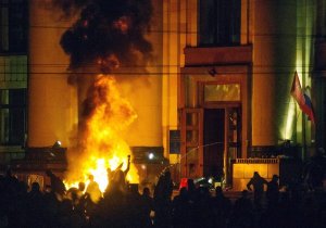 Pro-Russia protesters burn tires near a regional administration building in Kharkiv in a back-and-forth clash with riot police for control of the building. (Oleg Shishkov, EPA / April 7, 2014)