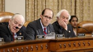 House Ways and Means Committee Chairman Rep. Dave Camp, R-Mich. (center), flanked by the committee's ranking member, Sander Levin, D-Mich. (right), and Sam Johnson, R-Texas.
