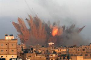 Smoke and fire rise above the skyline following an Israeli air strike on July 11 in Rafah in the southern Gaza Strip. Israeli warplanes kept up deadly raids on Gaza Friday but failed to stop Palestinian militants firing rockets across the border (NBC News).