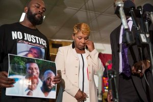Michael Brown Sr. and Lesley McSpadden, while mourning their son, asked supporters to remain peaceful. Credit Whitney Curtis for The New York Times