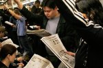 nyc_subway_riders_with_their_newspapers