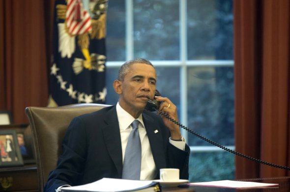 In this image made through a window of the Oval Office, President Obama speaks on the phone to Saudi Arabia's King Abdullah on Wednesday (NPR)