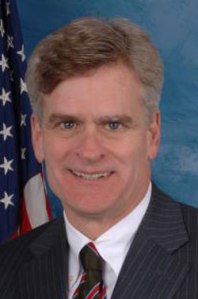 Bill Cassidy tries to smile and fails miserably.