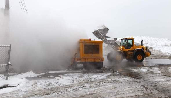 BOSTON - FEBRUARY 8: Crews use an Aero Snow Melter to dispatch mounds of snow at the Marine Industrial Park snow farm on February 8, 2015. (Photo by Pat Greenhouse/The Boston Globe via Getty Images)