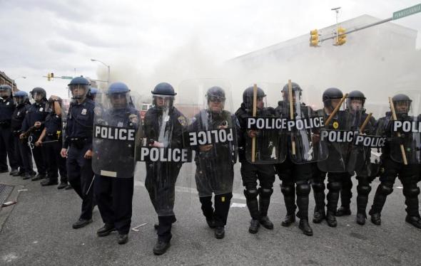 Baltimore police confront violent protesters