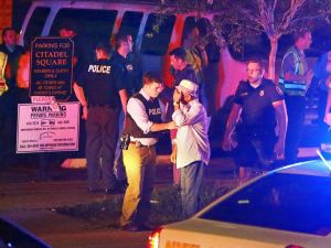 AP photo: Police talk to a man outside the Emanuel AME Church following a shooting, June 17, 2015, in Charleston, South Carolina.