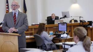 Owen Labrie's defense attorney Jaw W. Carney, left, gives his opening arguments as prosecutor Catherine Ruffle, lower right and Judge Larry Smukler listen Tuesday, Aug. 18, 2015, in Merrimack County Superior Court in Concord, N.H. Labrie is charged with raping a 15-year-old freshman at St. Paul's School on May 30, 2014, as part of a tradition known as the "Senior Salute" days before he graduated. (AP Photo/Jim Cole)