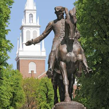 Statue of Paul Revere with the Old North Church in the background.