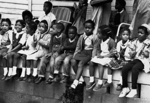 March 1965: Children watching a black voting rights march in Alabama. Dr Martin Luther King led the march from Selma, Alabama, to the state capital in Montgomery. (Photo by William Lovelace/Express/Getty Images)