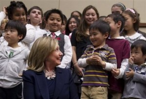 U.S. Secretary of State Hillary Rodham Clinton greets the children of U.S. Embassy employees at the embassy in Tokyo Sunday, April 17, 2011. Clinton is on a brief visit to Tokyo intended as a morale boost to the crucial U.S. ally. (AP Photo/Saul Loeb, Pool)