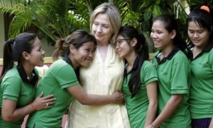REFILE - CORRECTING SPELLING U.S. Secretary of State Hillary Clinton is greeted by human trafficking victims Van Sina (2nd L) and Somana (3rd R) at the Siem Reap AFESIP rehabilitation and vocational training center October 31, 2010. Clinton's visit to Cambodia is the first by a U.S. Secretary of State since 2003. REUTERS/Chor Sokunthea (CAMBODIA - Tags: POLITICS)