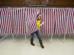 woman exists voting booth, Laonia,&nbsp;NH