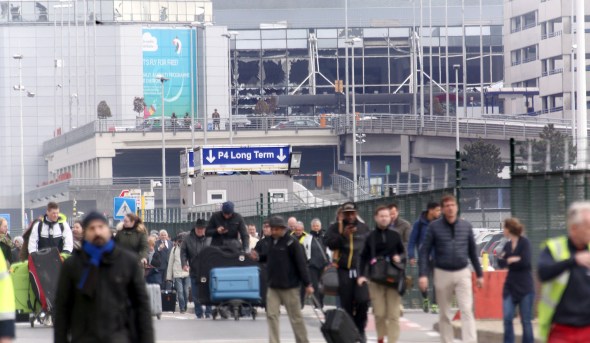 BRUSSELS, BELGIUM - MARCH 22: Passengers are evacuated from Zaventem Bruxelles International Airport after a terrorist attack on March 22, 2016 in Brussels, Belgium. At least 13 people are though to have been killed after Brussels airport was hit by two explosions whilst a Metro station was also targeted. The attacks come just days after a key suspect in the Paris attacks, Salah Abdeslam, was captured in Brussels. (Photo by Sylvain Lefevre/Getty Images)