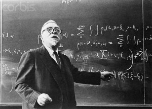 ca. 1958, Cambridge, Massachusetts, USA --- Dr. Norbert Wiener Standing at Blackboard --- Image by © Bettmann/CORBIS