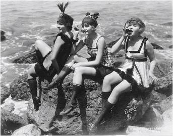 play-flappers-on-rocks-beach-vintage-women-fun