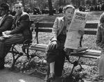 A woman on a bench reading a newspaper in Washington Square Park, Greenwich Village, 1955. (Getty&nbsp;Images)