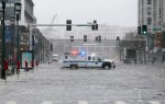 Water floods from Boston Harbor onto Seaport Boulevard in the Seaport district of Boston. — Greg Cooper EPA-EFE REX&nbsp;Shutterstock
