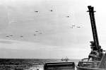 U.S. navy patrol torpedo boats cross the English Channel as B-1s, known as Flying Fortresses, fly&nbsp;overhead.