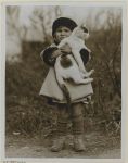 girl holding cat