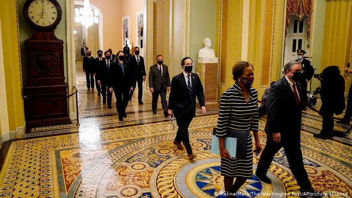 Clerk of the House Cheryl Johnson along with acting House Sergeant-at-Arms Tim Blodgett lead the Democratic House impeachment managers as they walk through the Capitol Hill