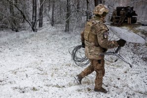 A Ukrainian soldier disconnects a Starlink satellite dish near Kreminna, Ukraine, last month.Credit...Clodagh KilcoyneReuters